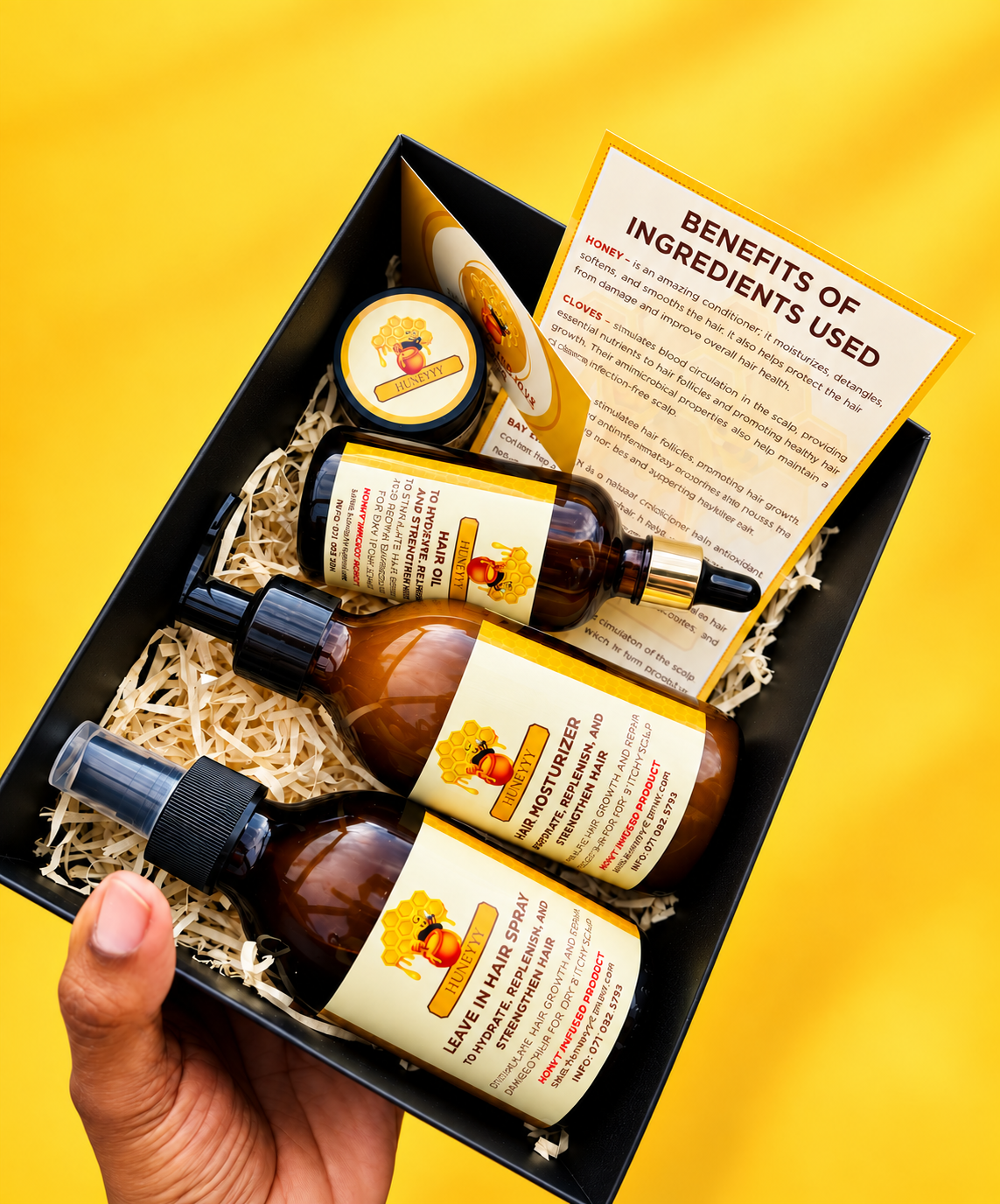 Huneyyy boxed product set with honey-infused haircare products on a yellow background